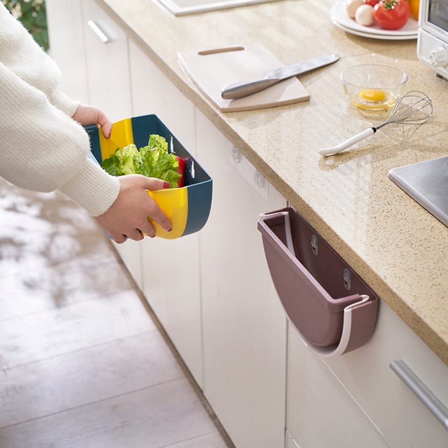 Convenient wall-mounted trash holder for any room.