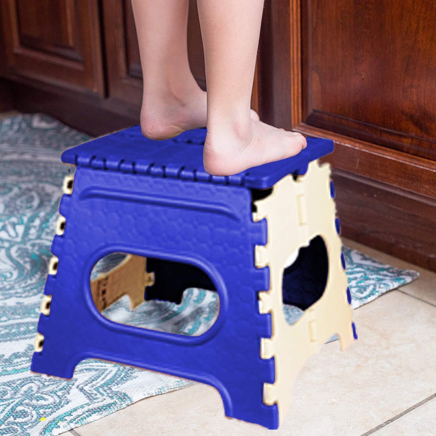 Durable folding step stool with a vibrant multicolor design and a handle for easy portability.